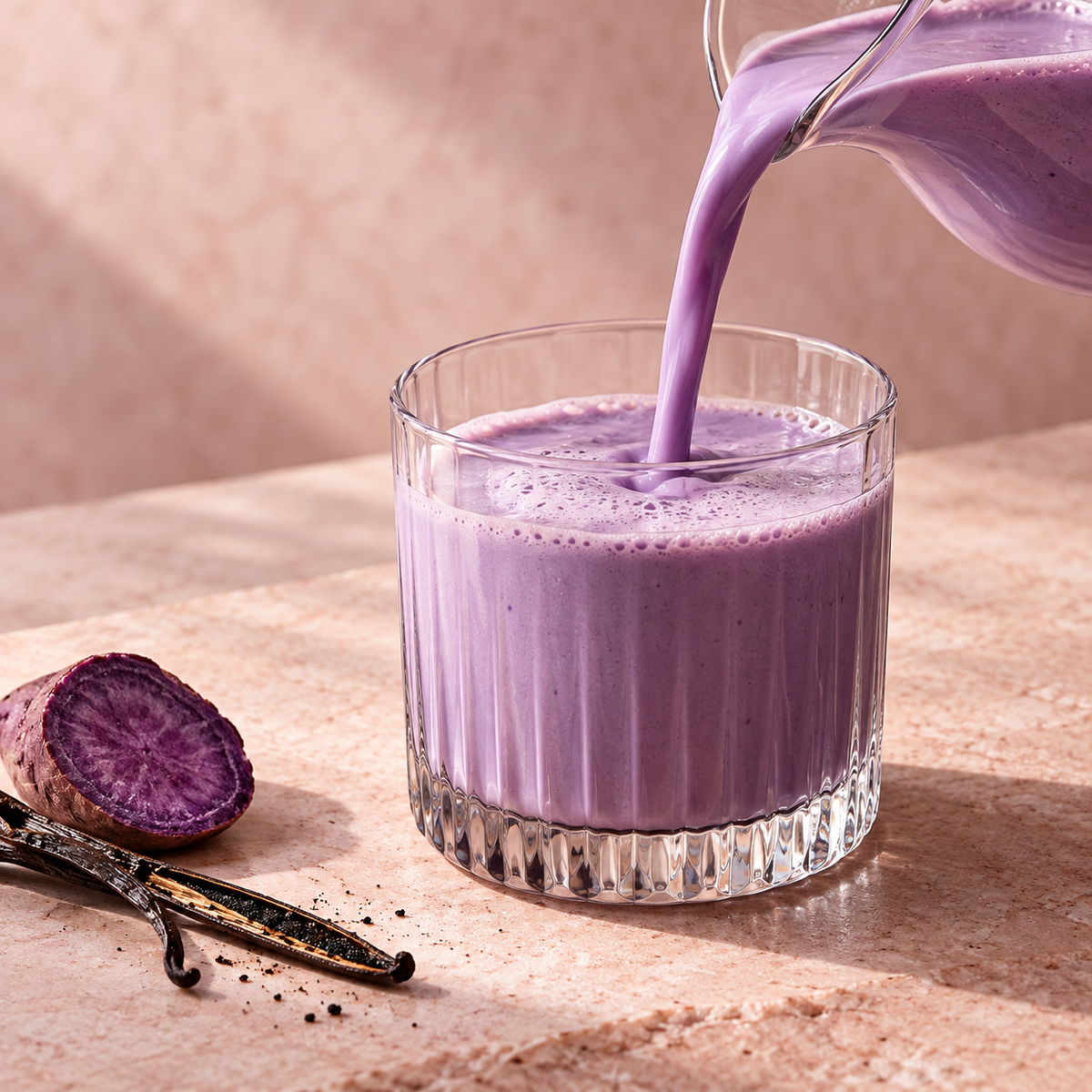 Creamy purple ube drink poured into a glass
